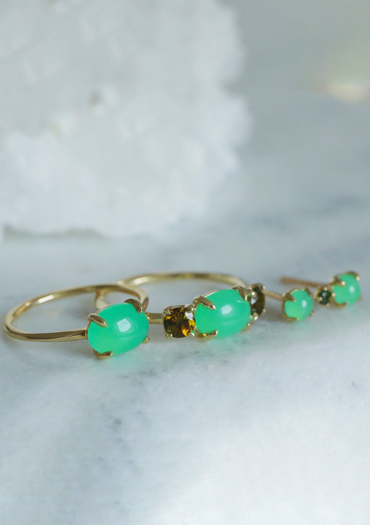 Three 10k solid gold rings from Carré set with the bright green gemstone chrysoprase in a round cut.