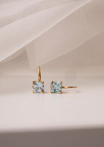 Gold plated earrings from Carré, set with a Blue Topaz gemstone. The blue topaz is also November's birthstone