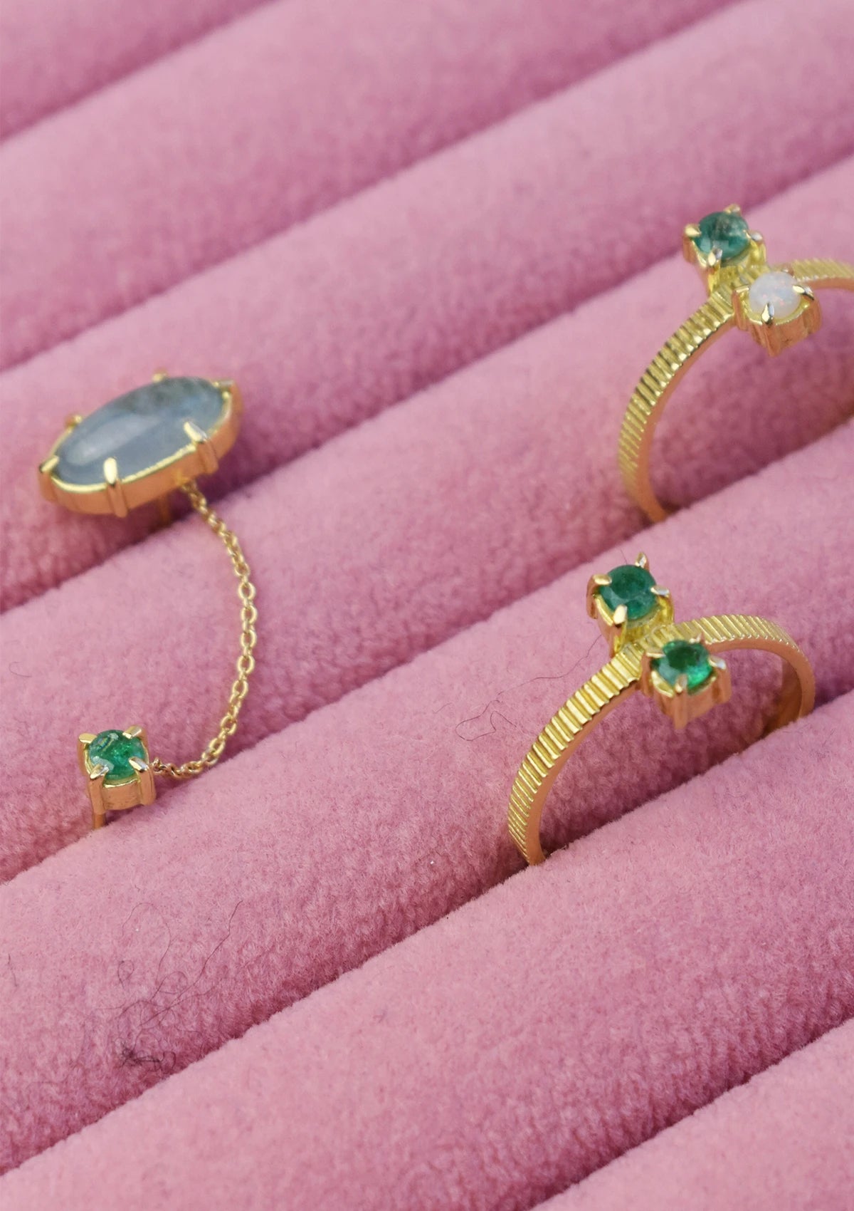 Emerald rings and an earstud with aquamarine and emerald from carre.