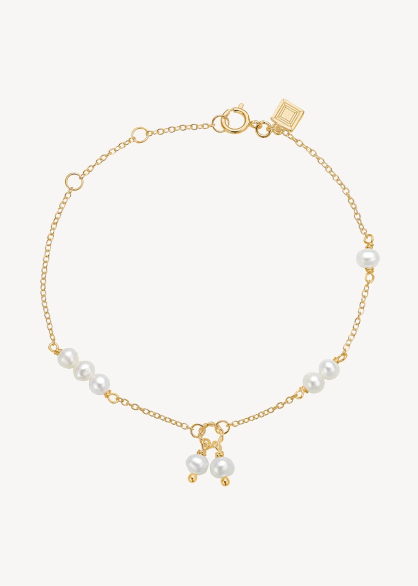Gold plated sterling silver bracelet with round white freshwater pearls in a cute 
 and elegant style