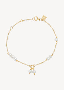 Gold plated sterling silver bracelet with round white freshwater pearls in a cute 
 and elegant style