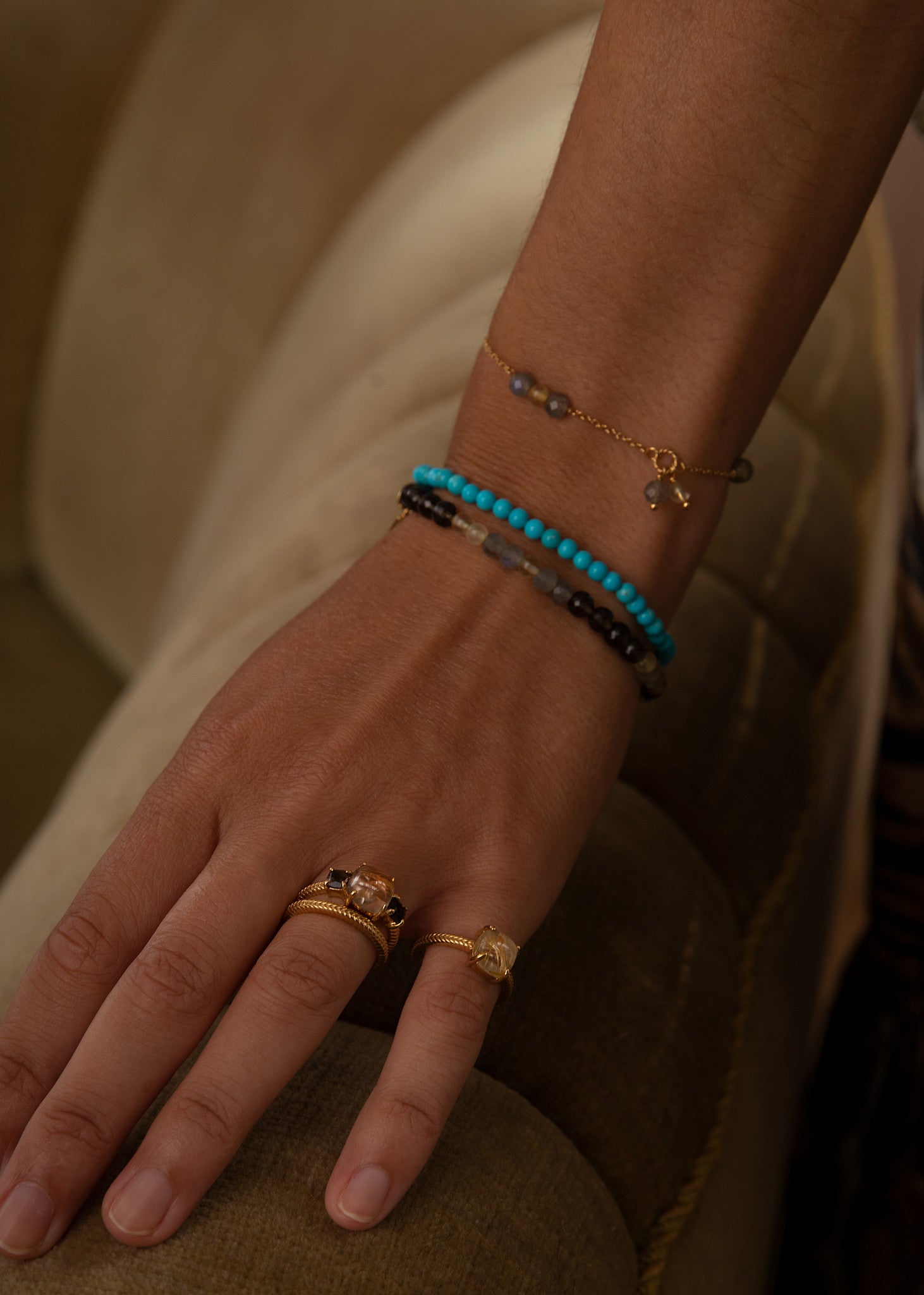 Woman with beaded gemstone bracelets from carré jewellery in danish design