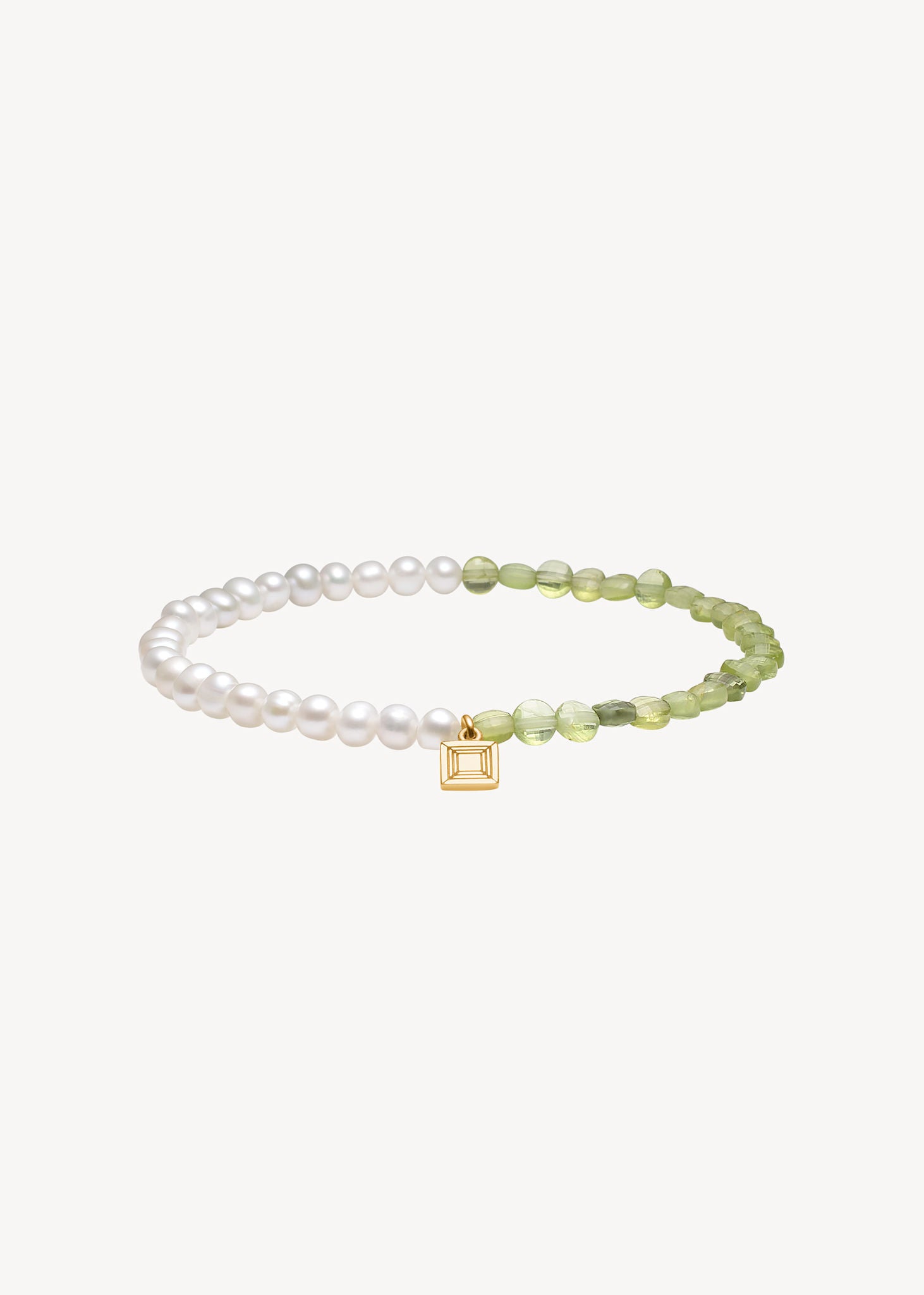 Handmade gemstone bracelet with recycled gemstones on elastic from carré jewellery set with June's birthstone, white freshwater pearls, and  August's birthstone, green peridot gemstones