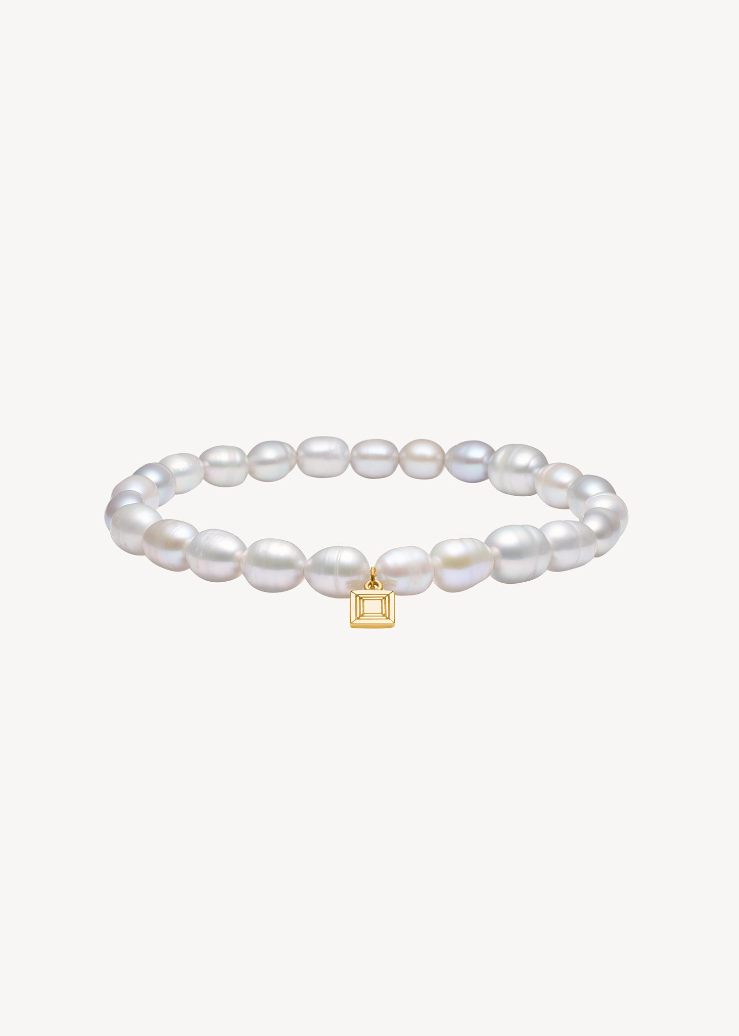 Slip on gemstone friendship bracelet from Carré Jewellery set with June's birthstone, grey freshwater pearls