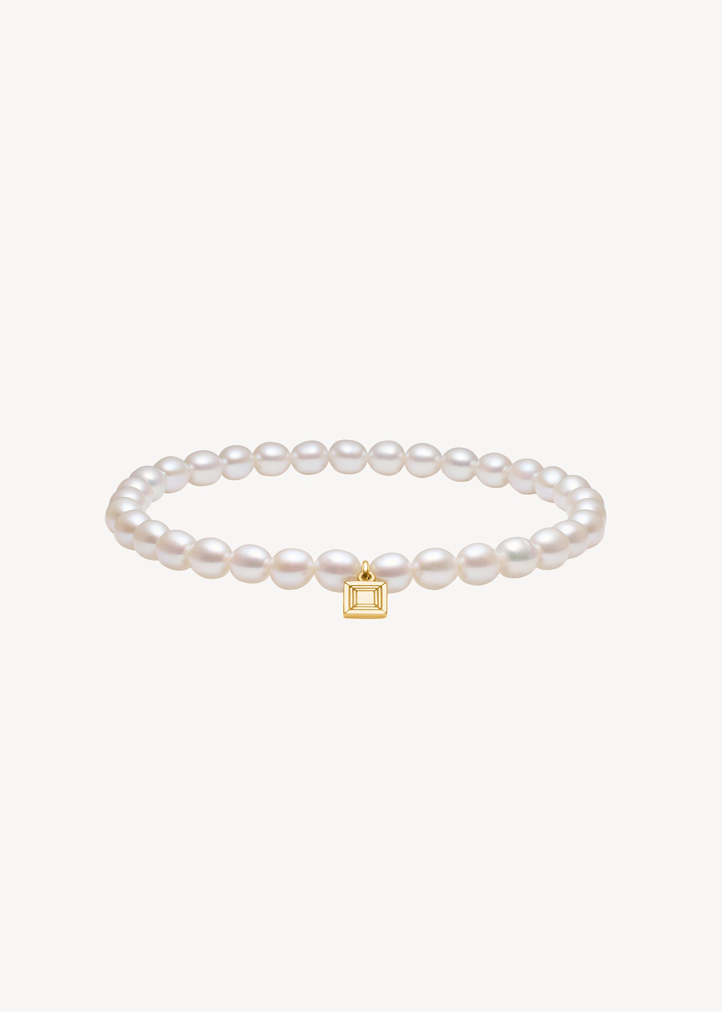 Slip on gemstone friendship bracelet from Carré Jewellery set with June's birthstone, white freshwater pearls