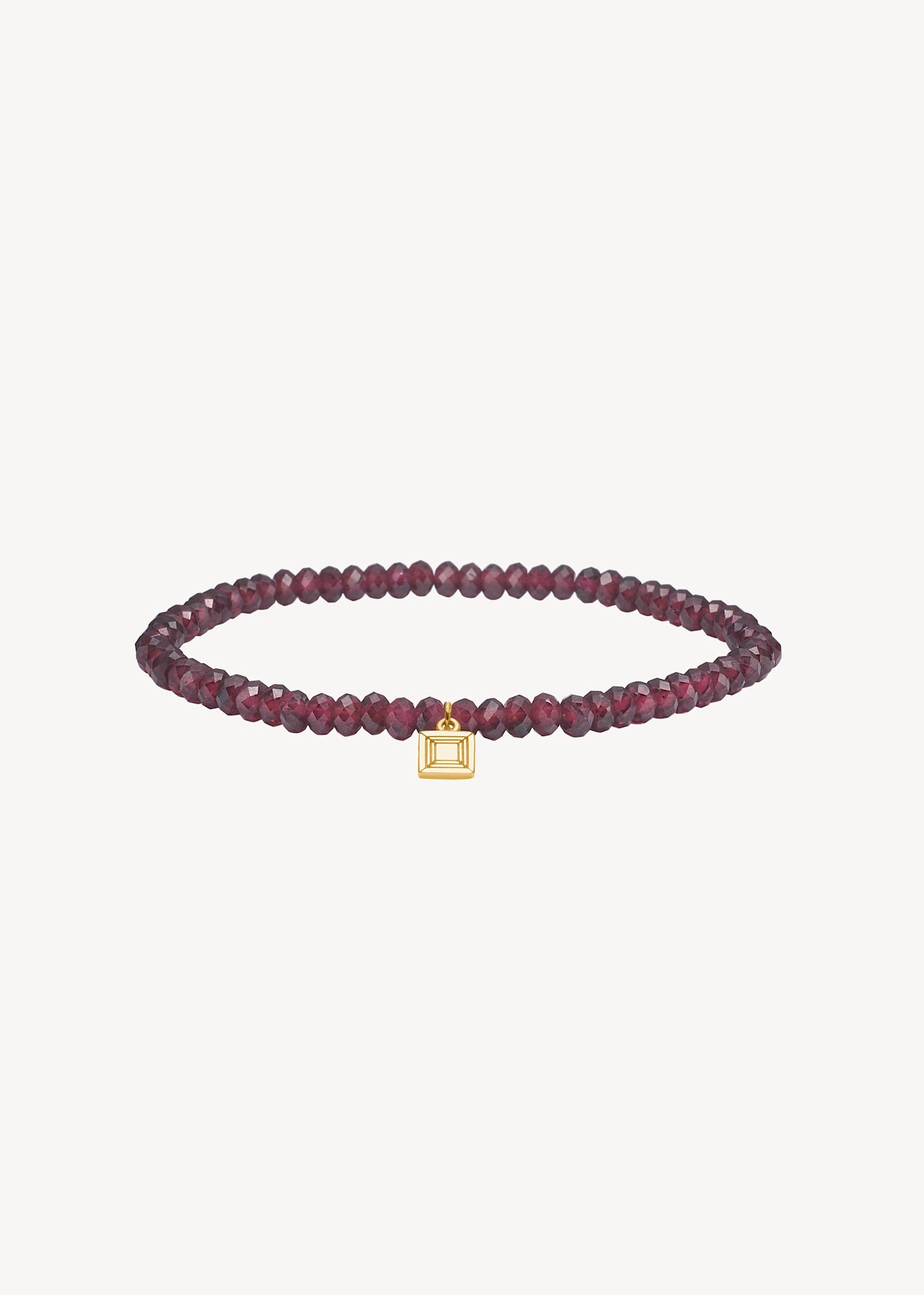 Slip on gemstone friendship bracelet from Carré Jewellery set with January's birthstone Red Garnet in a facet cut