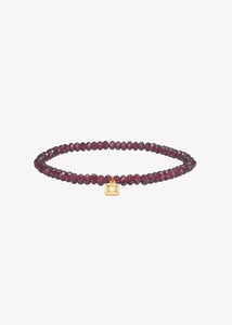 Slip on gemstone friendship bracelet from Carré Jewellery set with January's birthstone Red Garnet in a facet cut