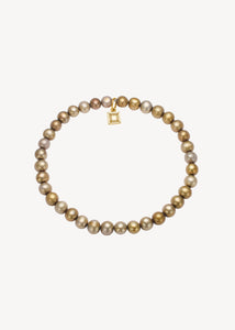 Slip on gemstone friendship bracelet from Carré Jewellery set with June's birthstone, golden freshwater pearl gemstones