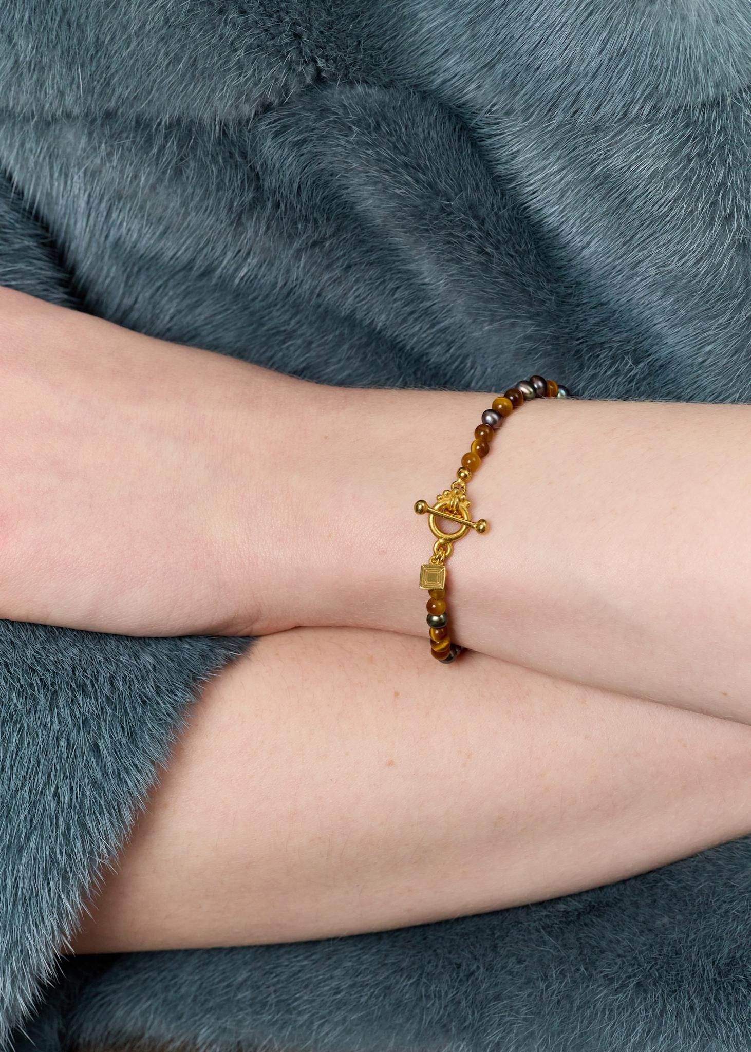 Uma bracelet with Peacock Beads and Tiger's Eye - gold plated