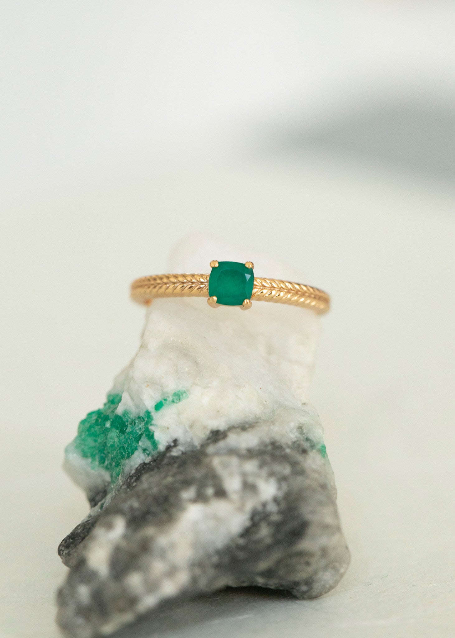 Gold plated sterling silver Kamila ring from Carré Copenhagen in a simple and elegant design with a green agate gemstone in facet-cut, which is May's birthstone