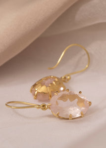 Large 18-karat solid gold earrings set with a facet-cut Rose Quartz gemstone