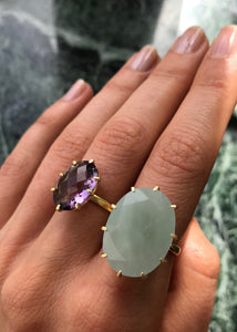 Woman wearing a large birthstone ring in 18 karat gold with a large aquamarine gemstone