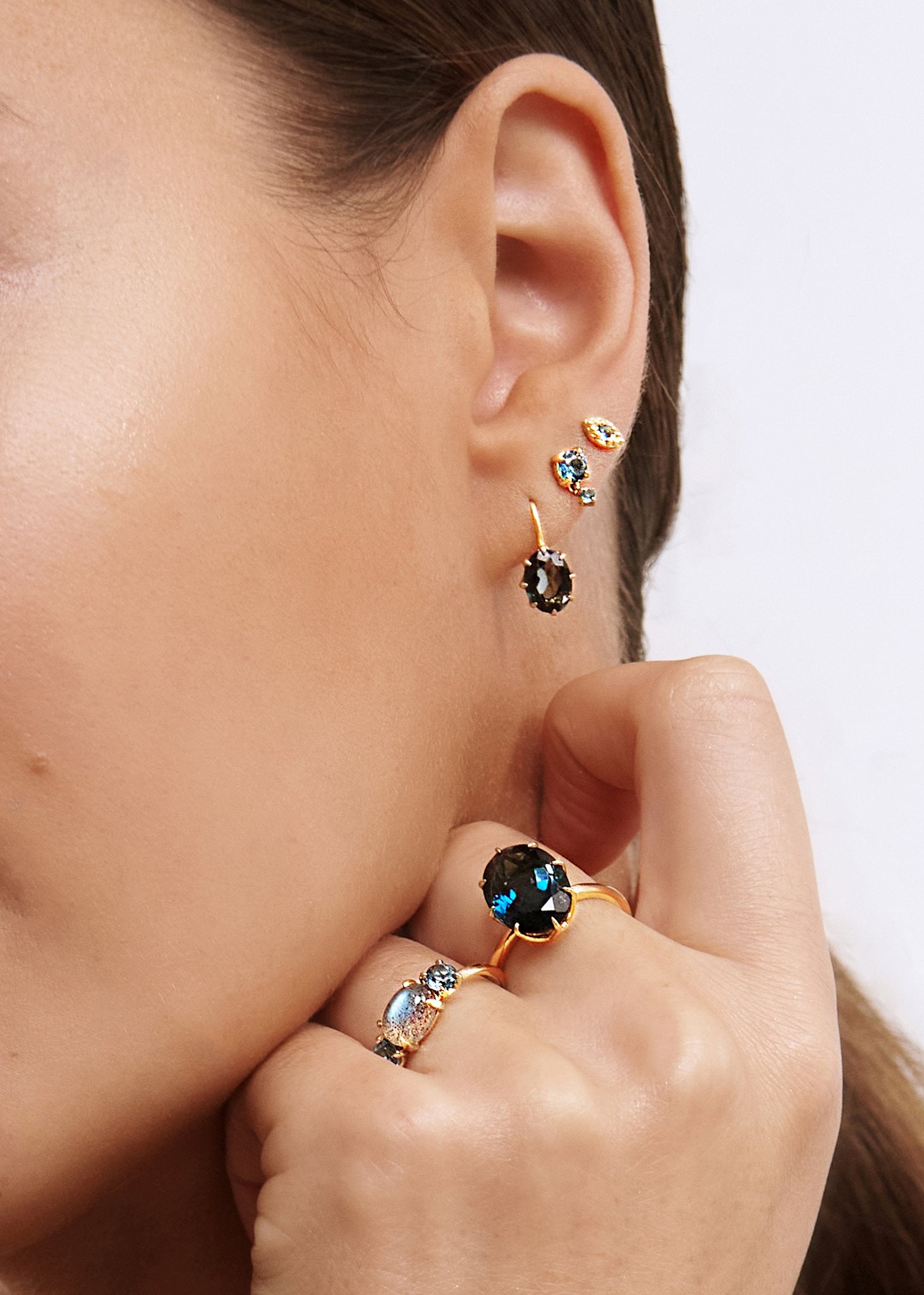 Woman with large london blue topaz gemstone ring in real gold 