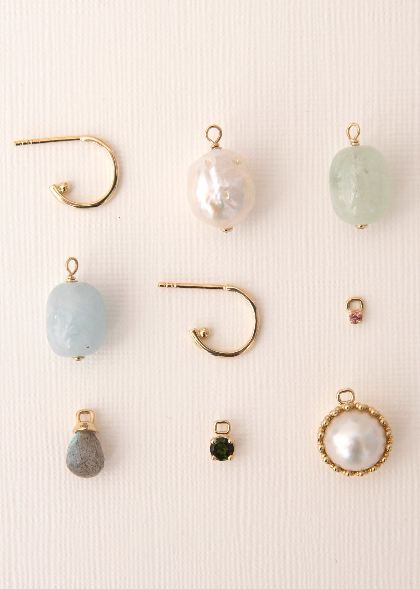 10 karat gold hoops and charms from carré jewellery set with colourful real gemstones and freshwater pearls