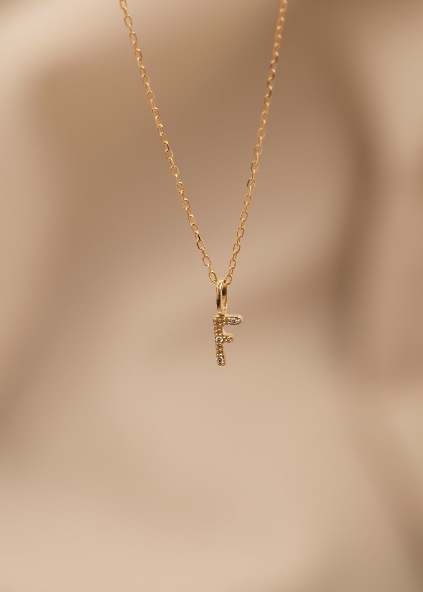 10-Karat Letter pendant with champagne Diamond - F