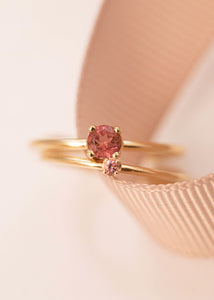 Two solid gold simple and elegant rings from carré jewellery with pink tourmaline gemstones in prong settings