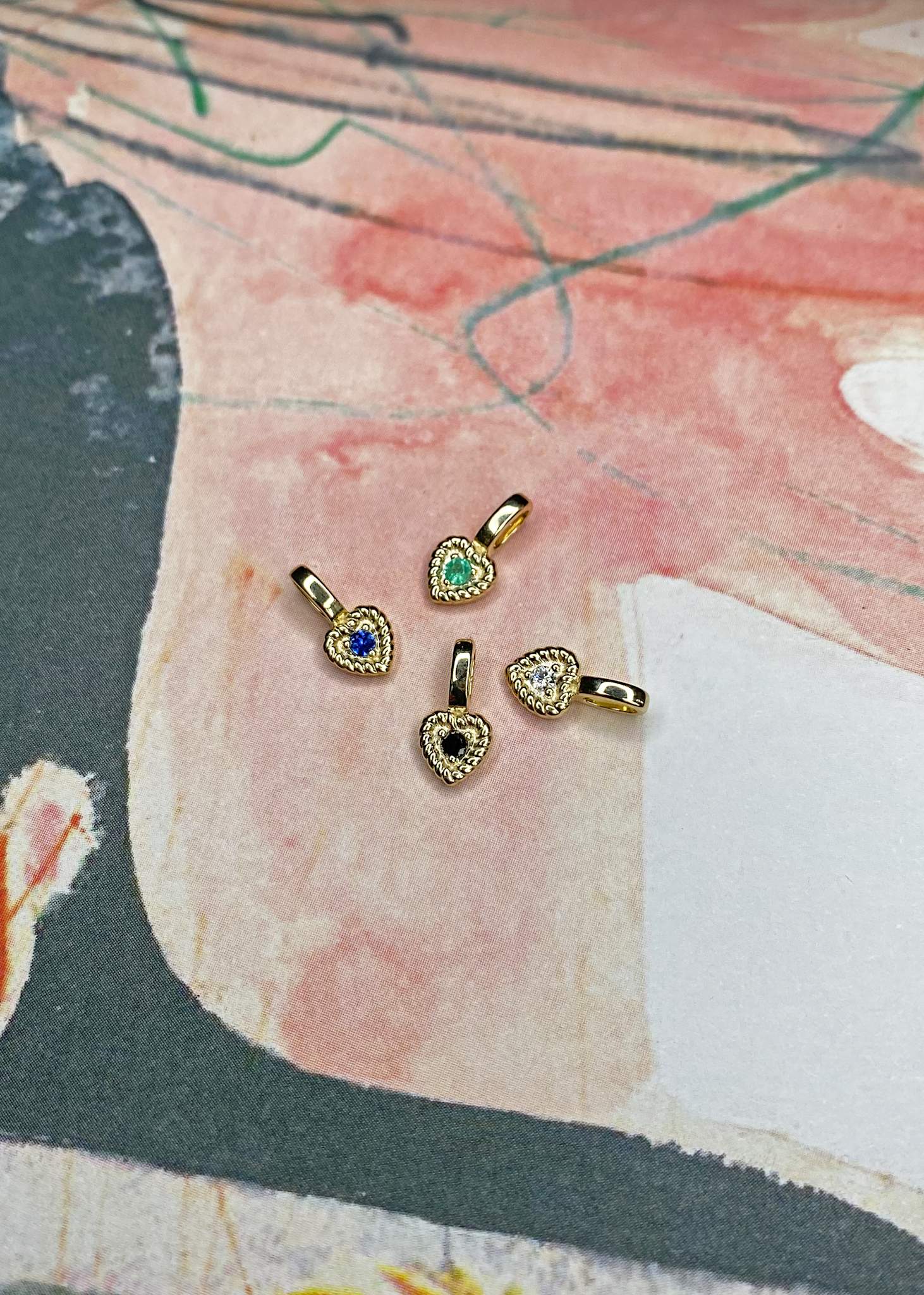 10-karat Amor pendant with Blue Sapphire