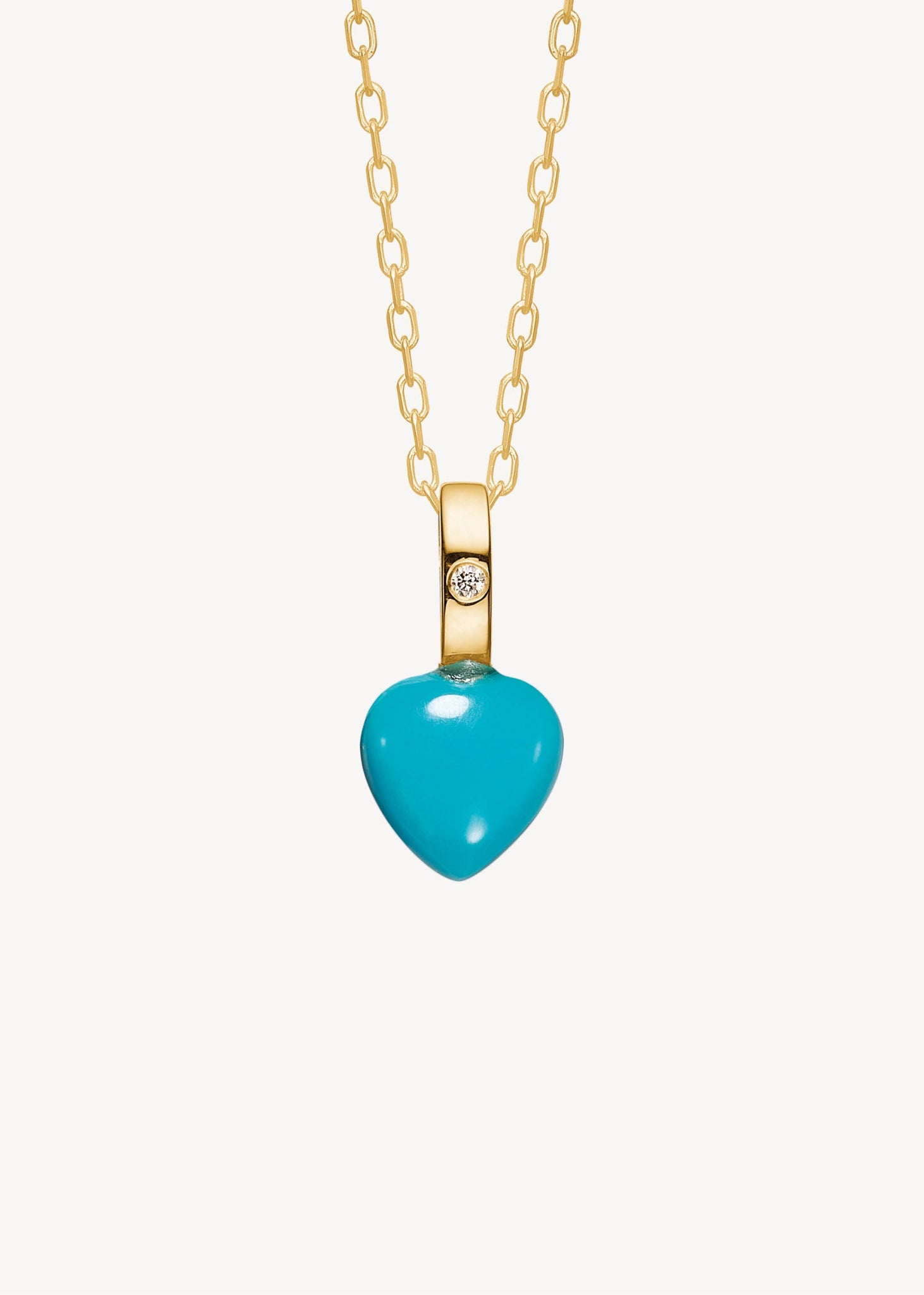 Heart pendant in gold for necklaces with december's birthstone Turquoise in a heart shape with a small diamond