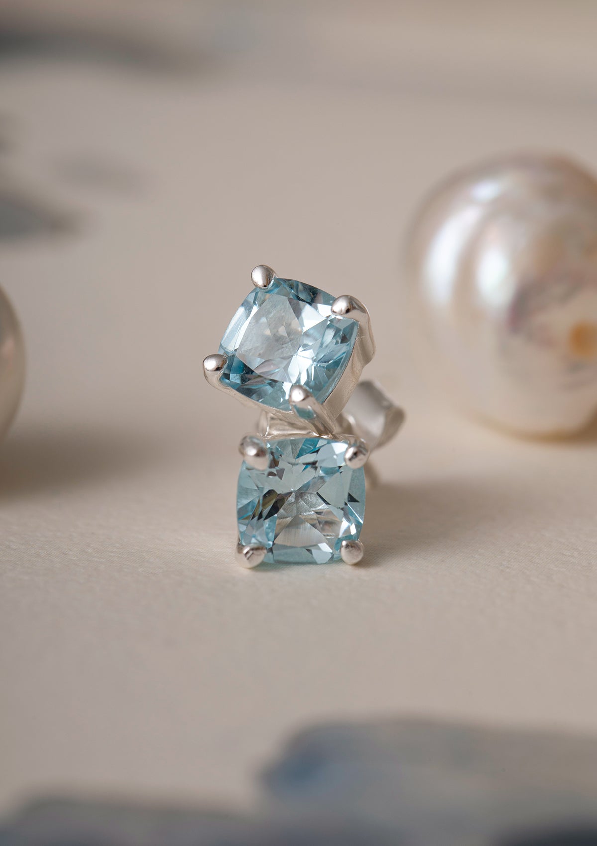 sterling silver ear studs from carré with large blue stones. The blue stones are blue topaz gemstones