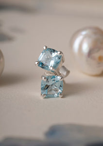 sterling silver ear studs from carré with large blue stones. The blue stones are blue topaz gemstones