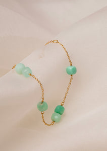 gold plated bracelet from carré with green stones. The green stones are chrysoprase gemstones