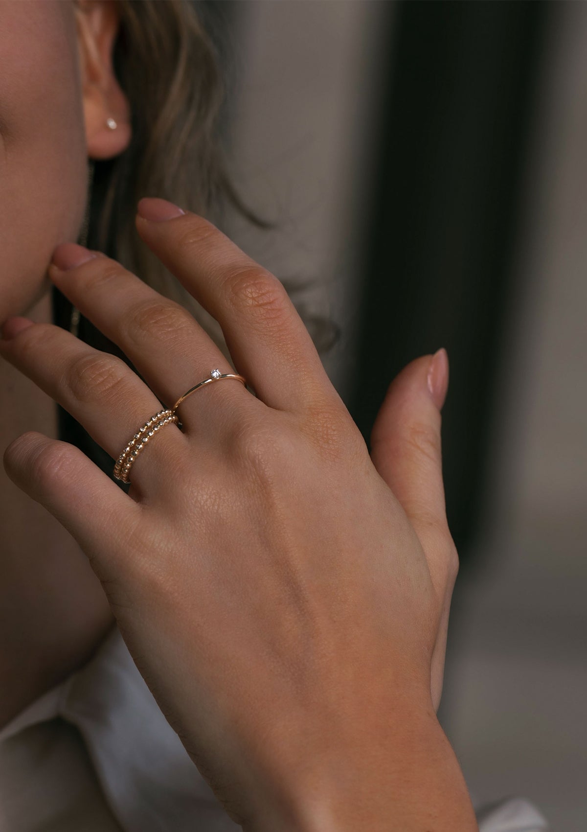 woman wearing a solid gold diamond ring from carré