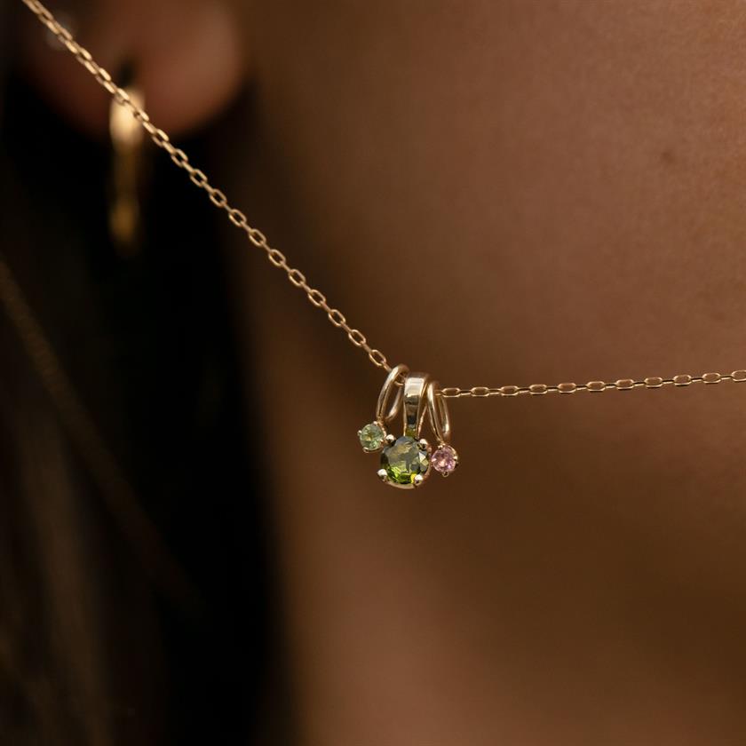 10 karat solid gold pendants for necklaces from carré jewellery set with facet-cut green and pink tourmaline gemstones