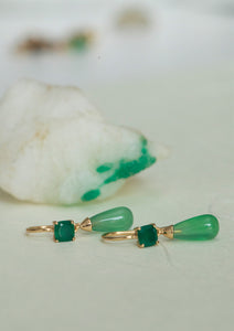 Long gold plated earrings with green stones from carré. The green stones are called green agate