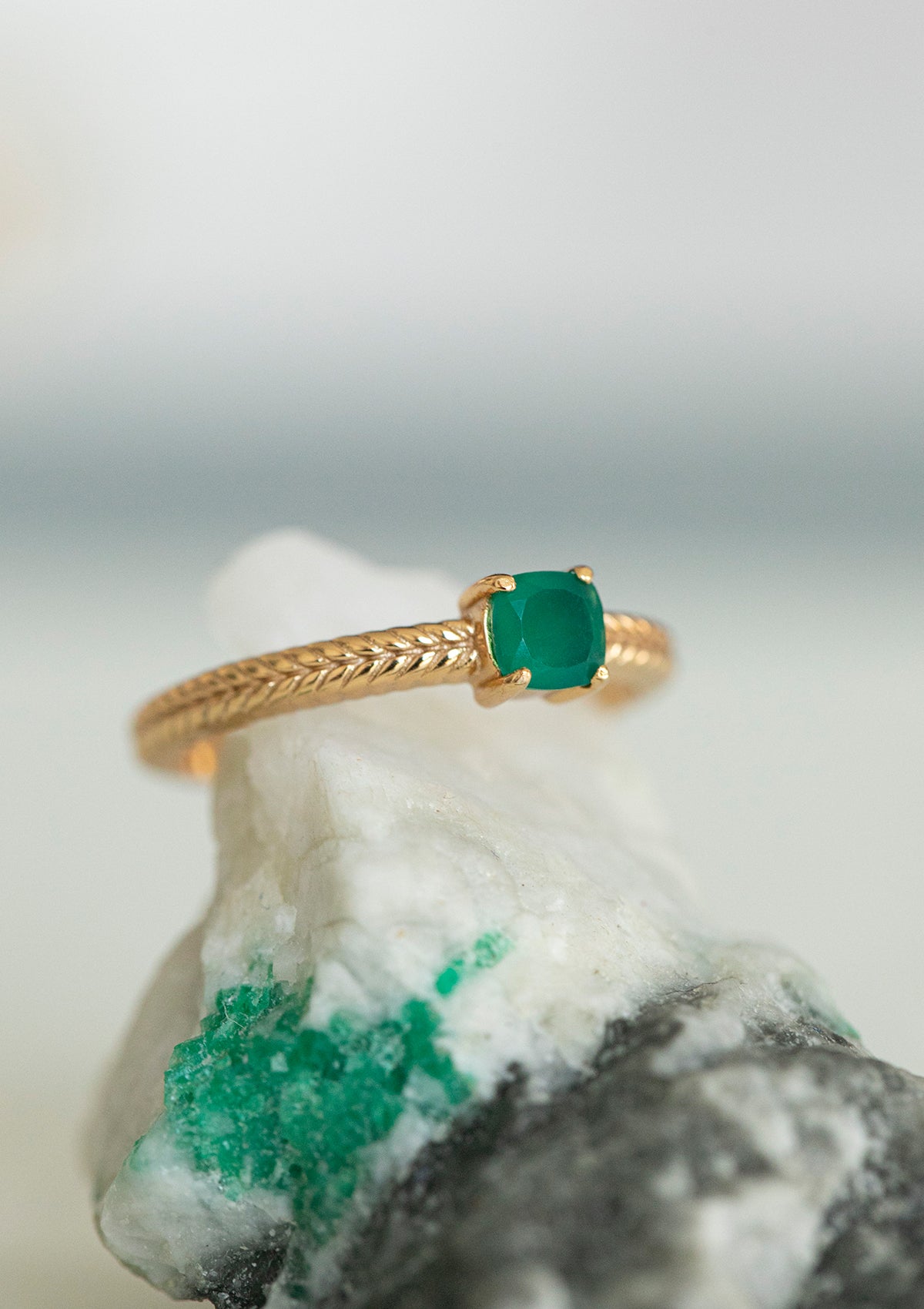 a gold plated ring with a green stone from carré. The stone is a green agate