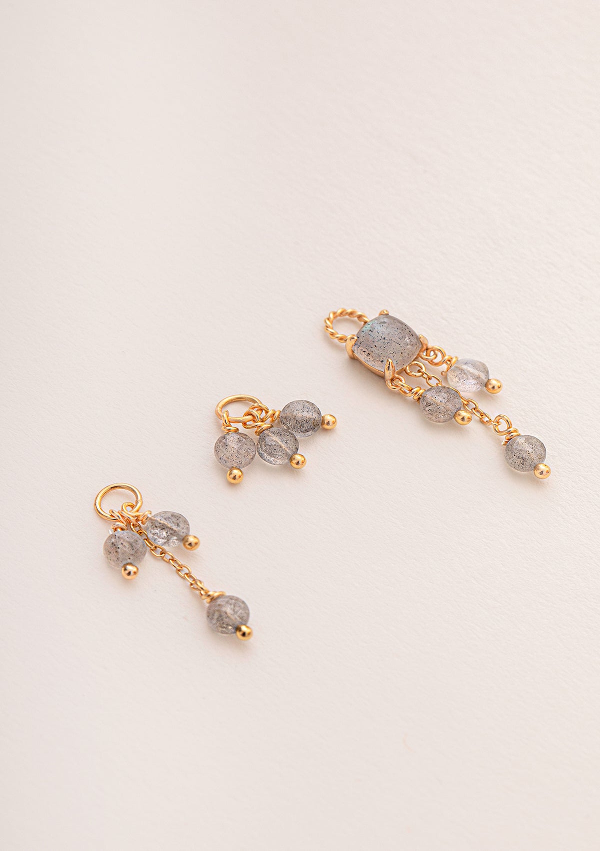 three gold plated charms for hoops set with long strings of labradorite gemstones