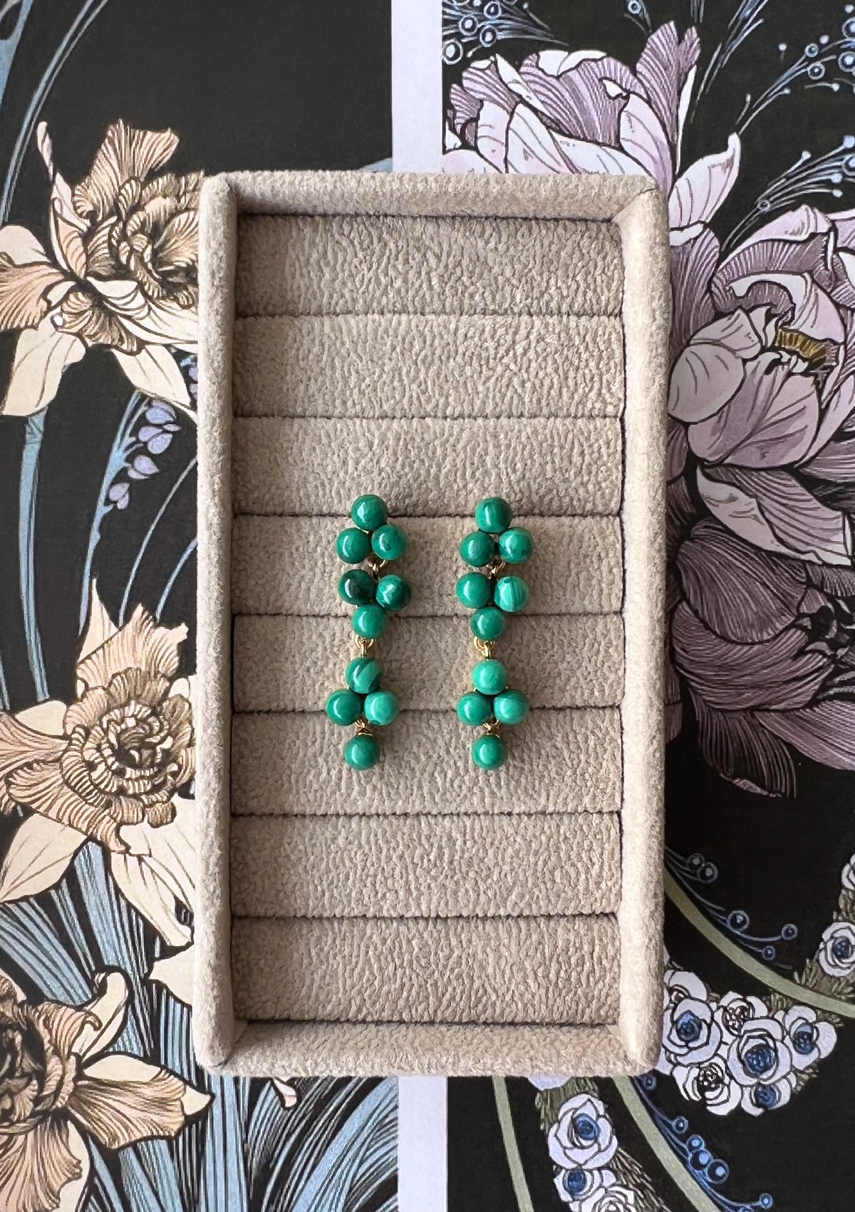 Long gold plated earrings with green malachite gemstones from carré