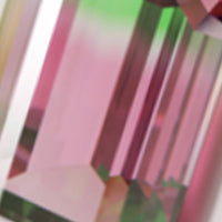 a facet cut rainbow tourmaline gemstone