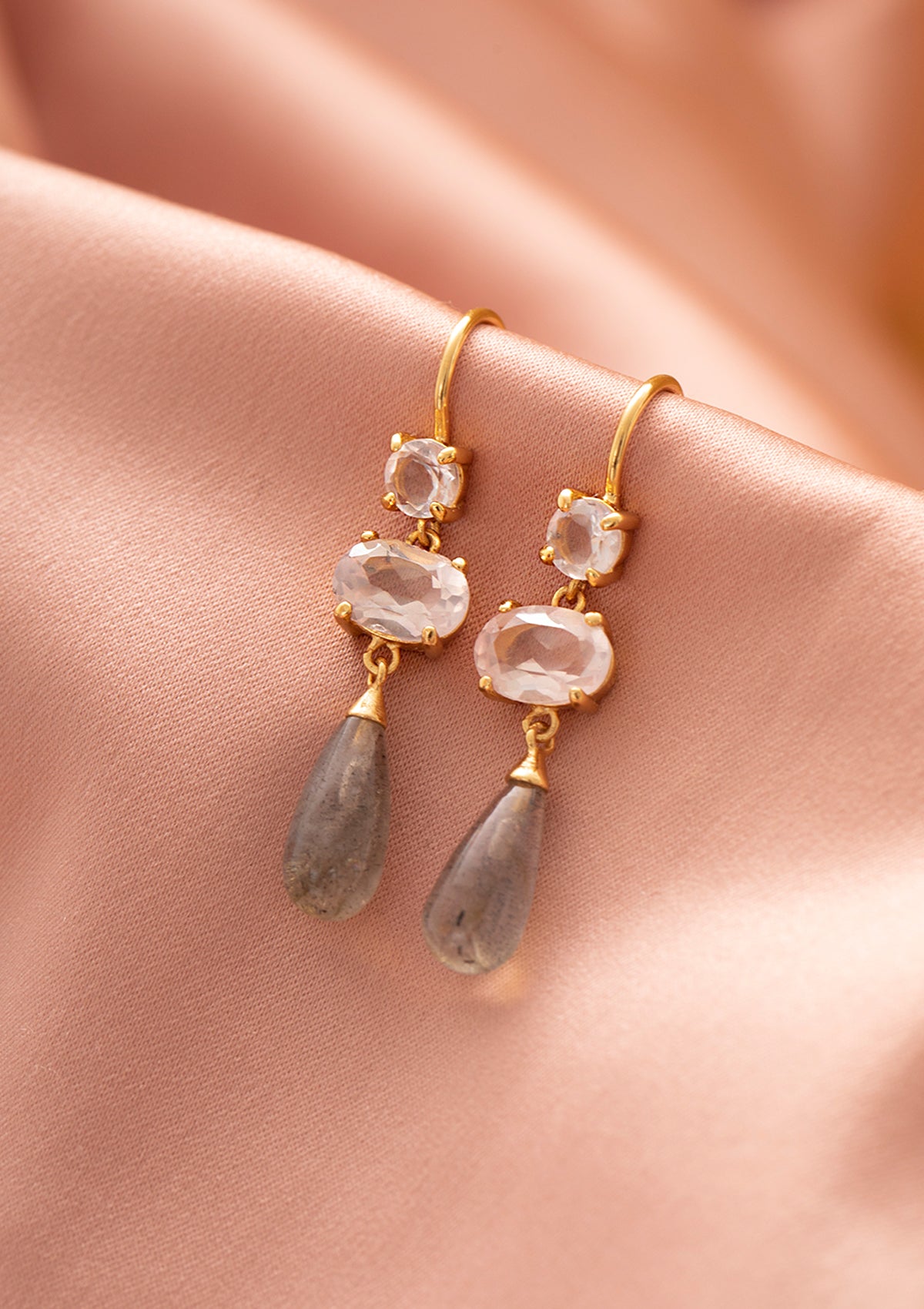 long gold plated earrings with pink stones from Carré. The two pink stones are rose quartz and the long drops at the bottom are labradorite