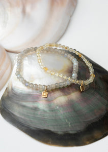 Two bracelets with gemstones from carré. The gemstones are golden rutile quartz and labradorite