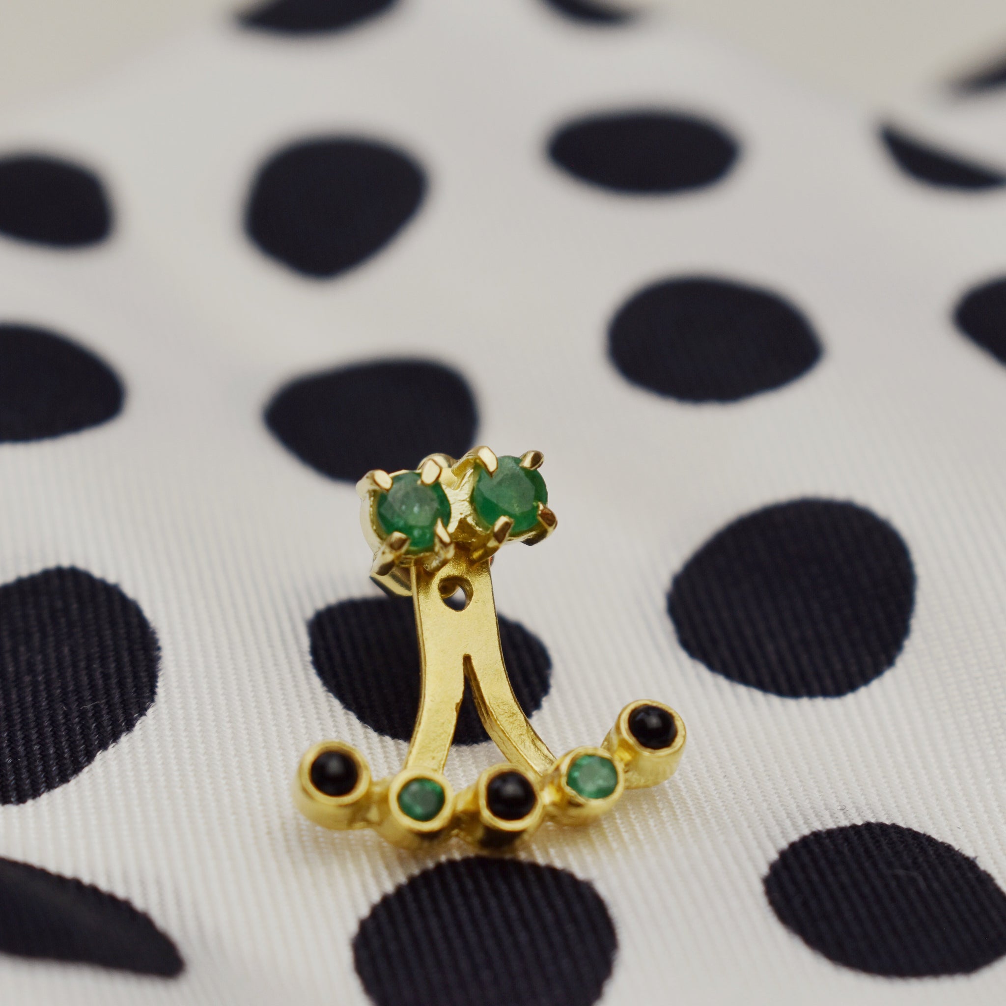 gold plated earring from carré set with black onyx and emeralds