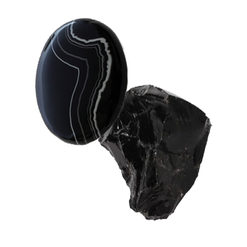 a cabochon-cut black agate and a raw black agate gemstone on an invisble background